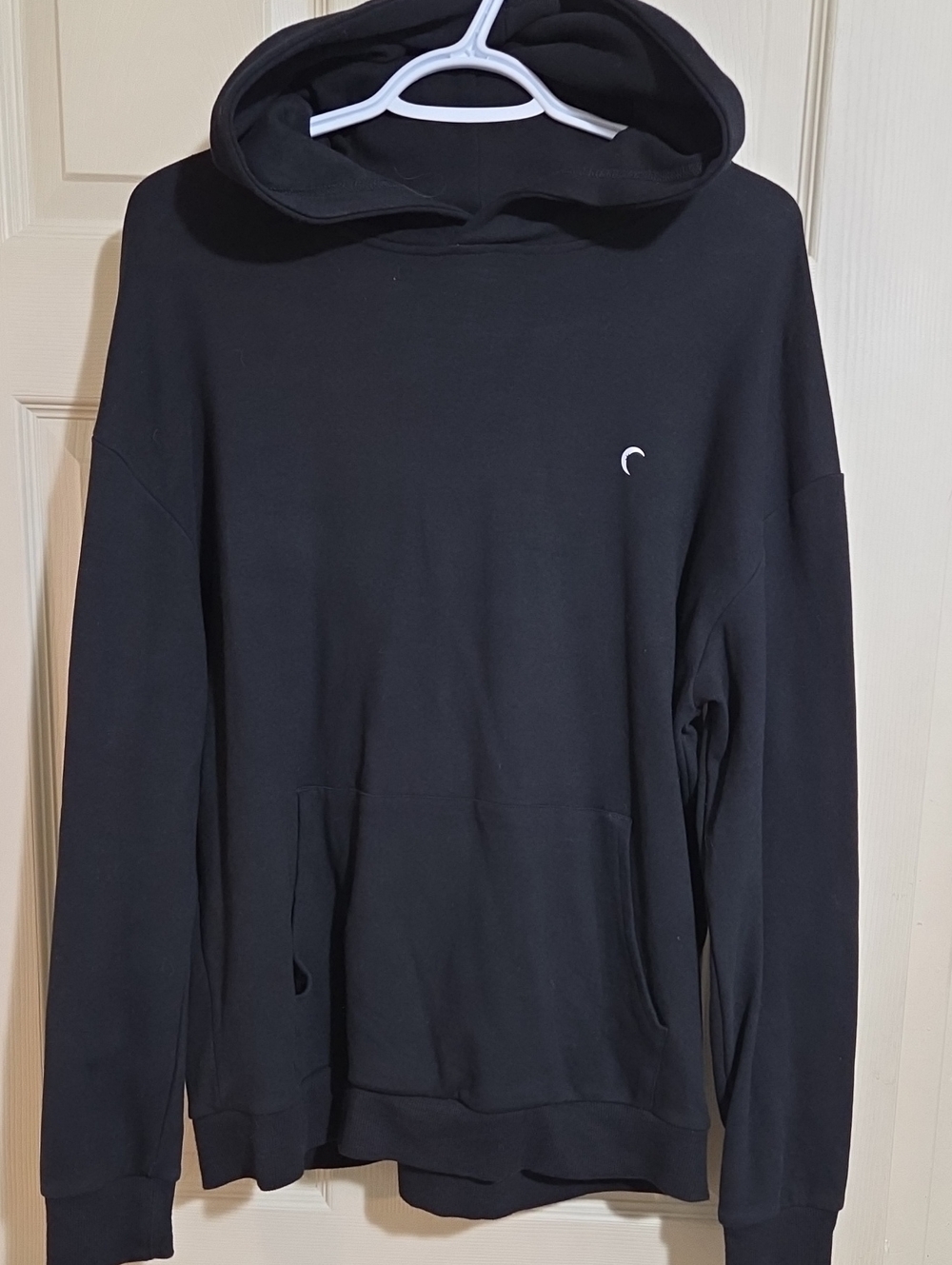 ZYIA Black Women's Pullover Hoodie with Small Crescent Detail